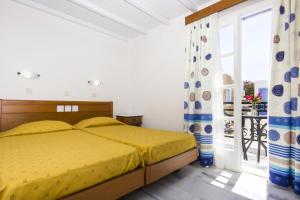 Postel nebo postele na pokoji v ubytování Naxos Holidays