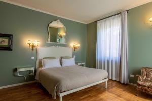 Postel nebo postele na pokoji v ubytování Relais Villa Borghetto