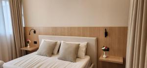 Postel nebo postele na pokoji v ubytování Signature Idea hotel