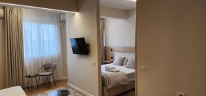 Postel nebo postele na pokoji v ubytování Signature Idea hotel