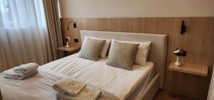 Postel nebo postele na pokoji v ubytování Signature Idea hotel