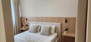 Postel nebo postele na pokoji v ubytování Signature Idea hotel