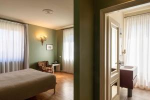 Postel nebo postele na pokoji v ubytování Relais Villa Borghetto