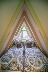 a bed in a room with a window at Ferienhaus Nordic Harmony in Waldkirchen