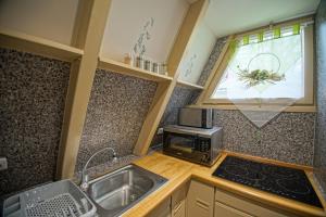 Kuchyň nebo kuchyňský kout v ubytování Ferienhaus Nordic Harmony + 25 fotografií