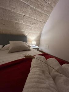 Voodi või voodid majutusasutuse B&B LE CUSPIDI toas