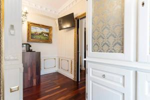 a room with a door and a painting on the wall at B&Boutique Lamezia Terme in Lamezia Terme