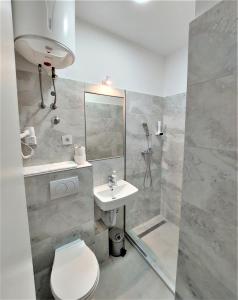 Koupelna v ubytování Orange Business Centar Apartments