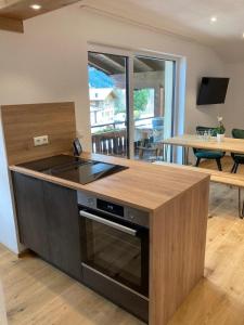 a kitchen with a stove and a counter top at Schöne Aussicht in Riezlern