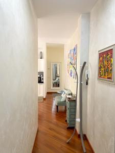 a hallway of a living room with a painting on the wall at Casa Corallo Vicino alle Spiagge in Sanremo