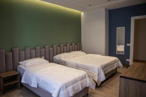 Letto o letti in una camera di Hotel Blini