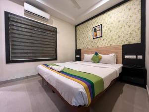 Ένα ή περισσότερα κρεβάτια σε δωμάτιο στο CMK GULMOHAR SUITS +63 φωτογραφίες