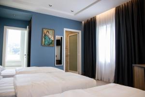 Letto o letti in una camera di Hotel Blini