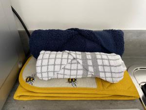 a pair of towels sitting on top of a stove at The Hideaway-Sharples-Bolton in Bolton