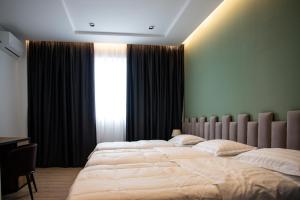 Letto o letti in una camera di Hotel Blini