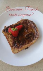 a white plate with a piece of french toast with strawberries at Wild Atlantic Lodge Bed & Breakfast in Lahinch