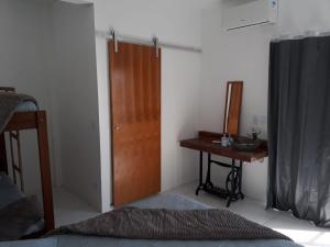 Postel nebo postele na pokoji v ubytování Recanto da Preguiça - Suites + 1 fotografie