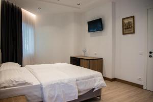 Letto o letti in una camera di Hotel Blini