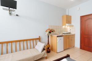 a small kitchen with a couch and a table at Villa Estelle in Paralia Katerinis +23 photos