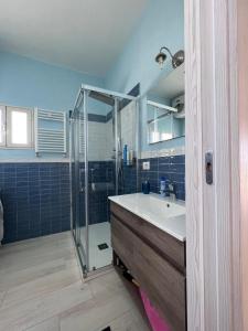 a bathroom with a sink and a shower at Villa Santo Stefano in Monopoli