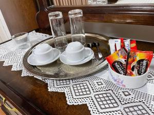 a table with a tray with plates and dishes on it at Al-Daar in ‘Ayn Amūn