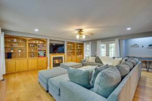 a living room with a couch and a tv at Massanutten Home Rental with Sauna and Game Room! in McGaheysville