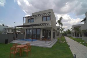 a rendering of a house with a table and chairs at Araya Beach Casas in Batangas City