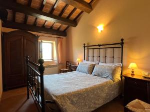 מיטה או מיטות בחדר ב-Agriturismo Le Sorgenti