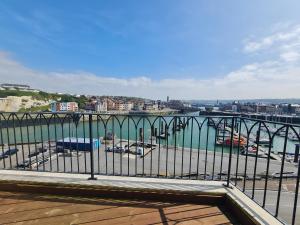 a view of a harbor with boats in the water at LA TOUR AUX CRABES près de la plage in Dieppe