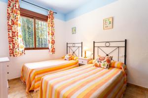 Postel nebo postele na pokoji v ubytování Cortijo La Reina + 30 fotografií