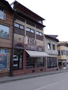 a store front of a building on a street at TRIO sobe in Jajce