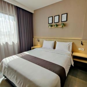 Postel nebo postele na pokoji v ubytování The Mango Suites by Flat06