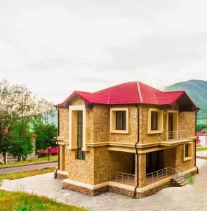 a model of a house with a red roof at Marxal Resort & Spa in Sheki