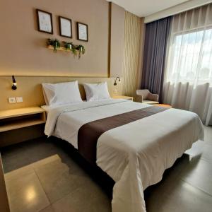 Postel nebo postele na pokoji v ubytování The Mango Suites by Flat06