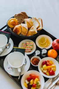 a tray of food with bread and other foods on it at Hôtel La Villa Cannes in Cannes