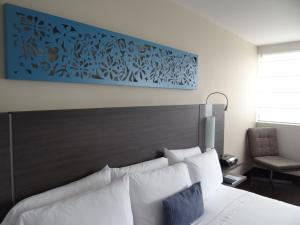 Voodi või voodid majutusasutuse Hotel bh El Poblado toas