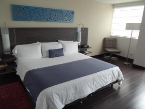 Voodi või voodid majutusasutuse Hotel bh El Poblado toas