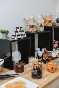 a table topped with lots of different types of food at Hôtel La Villa Cannes in Cannes