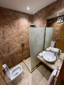 a bathroom with two sinks and a toilet in it at sea view house in Marsa Alam City