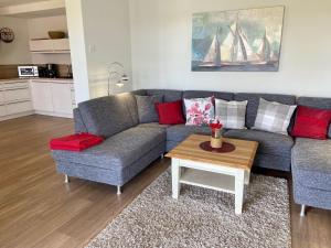a living room with a couch and a coffee table at 3001 - Grömitz in Grömitz