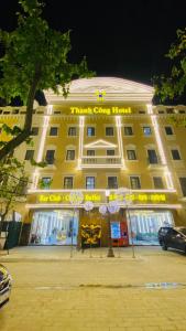 a large yellow building with a sign on it at Thanh Cong Hotel Ha Long in Ha Long
