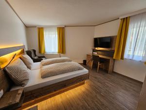 TV a/nebo společenská místnost v ubytování Hotel-Landgasthof Ploss