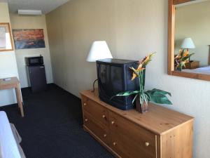 a tv on a dresser in a hotel room at Motel 6 Henderson NV in Las Vegas