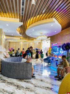 a group of people sitting in a lobby at Thanh Cong Hotel Ha Long in Ha Long