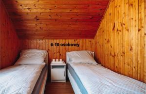 Łóżko lub łóżka w pokoju w obiekcie Słoneczne domki