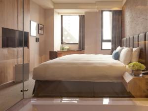 Voodi või voodid majutusasutuse Treeart Hotel toas