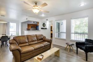 a living room with a couch and a ceiling fan at Serene Dallas Vacation Rental - Walkable Location! in Dallas