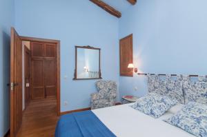 Postel nebo postele na pokoji v ubytování Casona De La Salceda