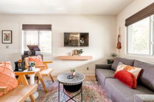 a living room with a couch and a table at Southbound Stays - Lonestar in Nashville