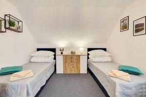 Postel nebo postele na pokoji v ubytování Apartament na wzgórzu